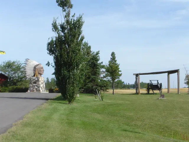 Indian Head statue and Red River cart